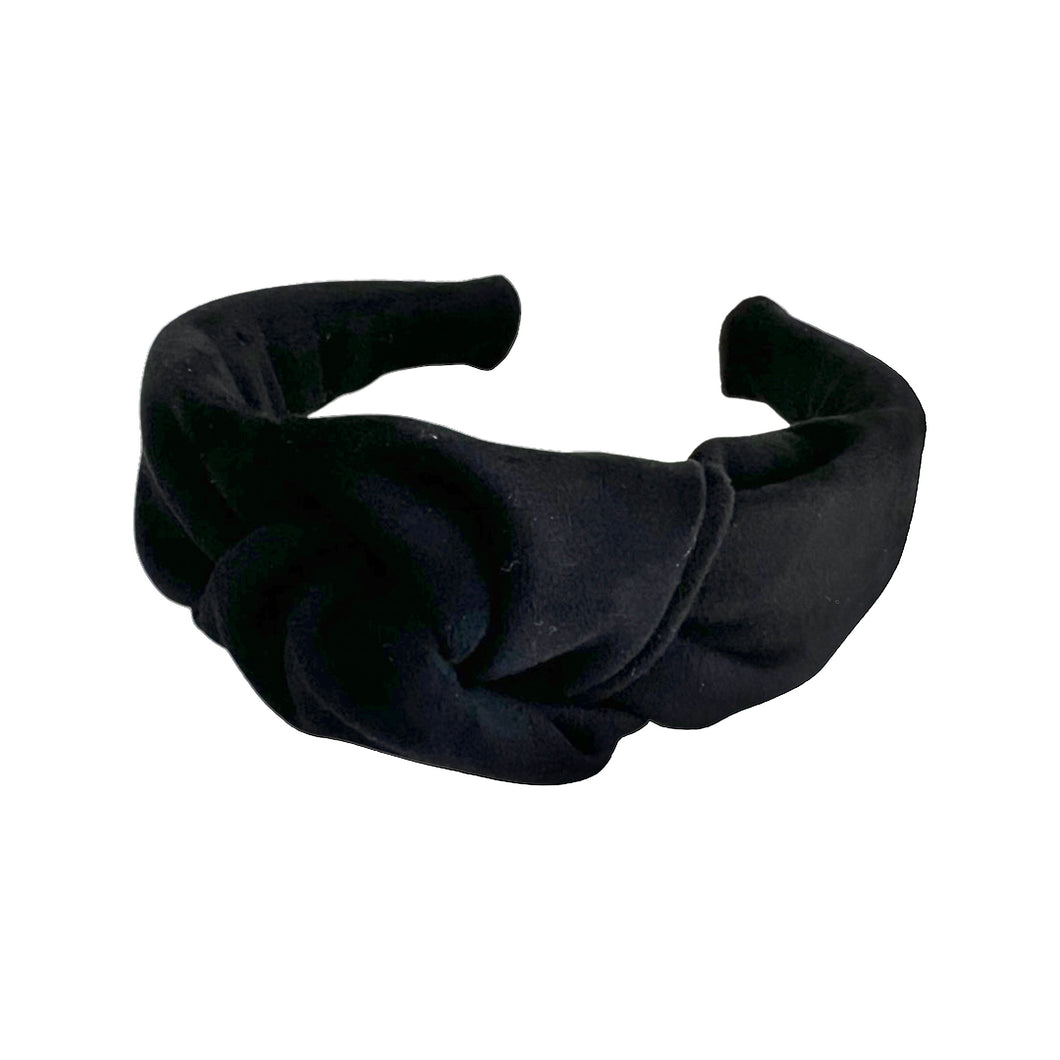 Add a touch of sophistication with our Black Suede Knotted Headband from SweetCityBows.com. Crafted with luxurious suede fabric, this headband exudes elegance and style. The versatile black color makes it a perfect accessory for any outfit. Elevate your little one's look with this chic and comfortable headband. Limited availability, order your Black Suede Knotted Headband now!