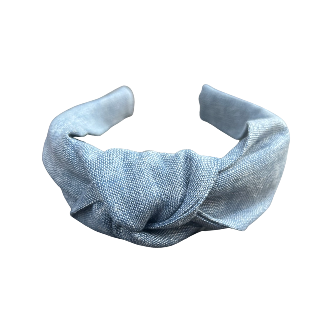 Experience the timeless appeal of our Chambray Linen Knotted Headband from SweetCityBows.com. Made with high-quality chambray linen, this headband combines comfort and style effortlessly. The classic chambray design adds a touch of sophistication to your child's ensemble. Complete their look with this versatile accessory. Limited quantities available, get your Chambray Linen Knotted Headband now!