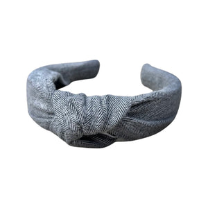 Elevate your style with our Gray Herringbone Knotted Headband from SweetCityBows.com. This chic headband features a classic gray herringbone pattern that adds a touch of sophistication to any outfit. Crafted with care, it ensures both comfort and style. Limited stock, order your Gray Herringbone Knotted Headband today and let your style shine!