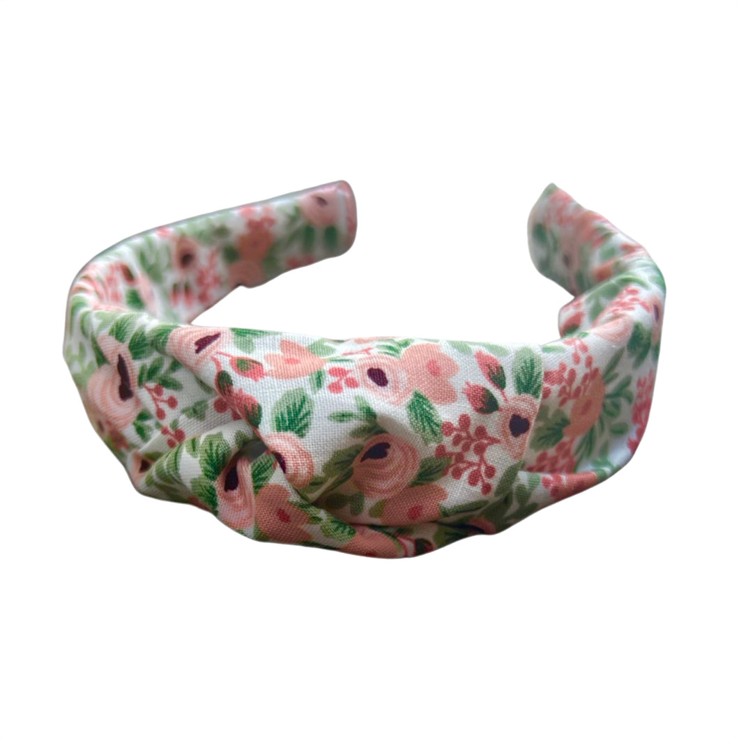Adorn your little one with the enchanting charm of our Petite Petals Knotted Headband from SweetCityBows.com. Handcrafted with care, this headband features delicate petals that add a touch of whimsy to any outfit. Elevate your child's style with this unique accessory. Limited availability, order your Petite Petals Knotted Headband now and let their beauty bloom!