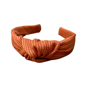 Experience the essence of autumn with our Pumpkin Spice Knotted Headband from SweetCityBows.com. This charming headband showcases a delightful pumpkin spice color that perfectly captures the cozy vibes of the season. Crafted with love, it adds a touch of warmth and style to your outfit. Limited stock, order your Pumpkin Spice Knotted Headband today and embrace the fall spirit!